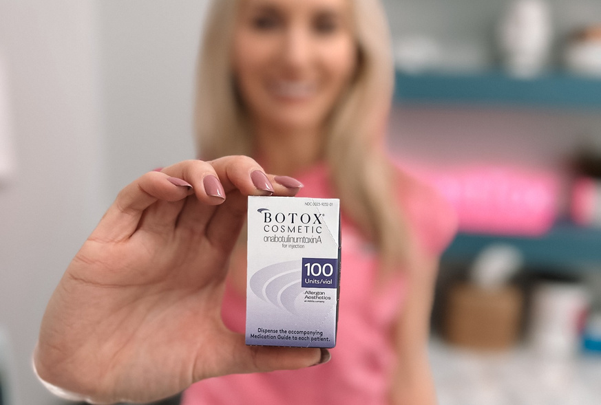 Refresh - Aesthetics & Wellness provider holding a box of Botox Cosmetic in a Florida med spa